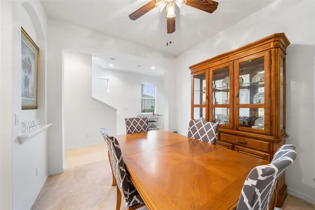 a dining room with furniture and window