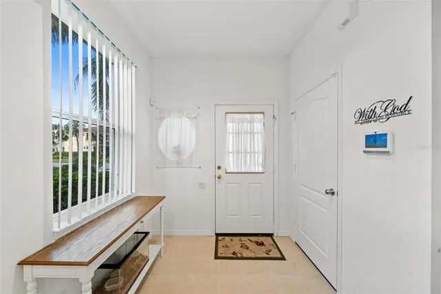 a view of a hallway with entryway door