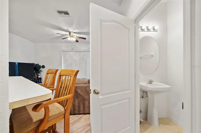 a view of a hallway with seating space