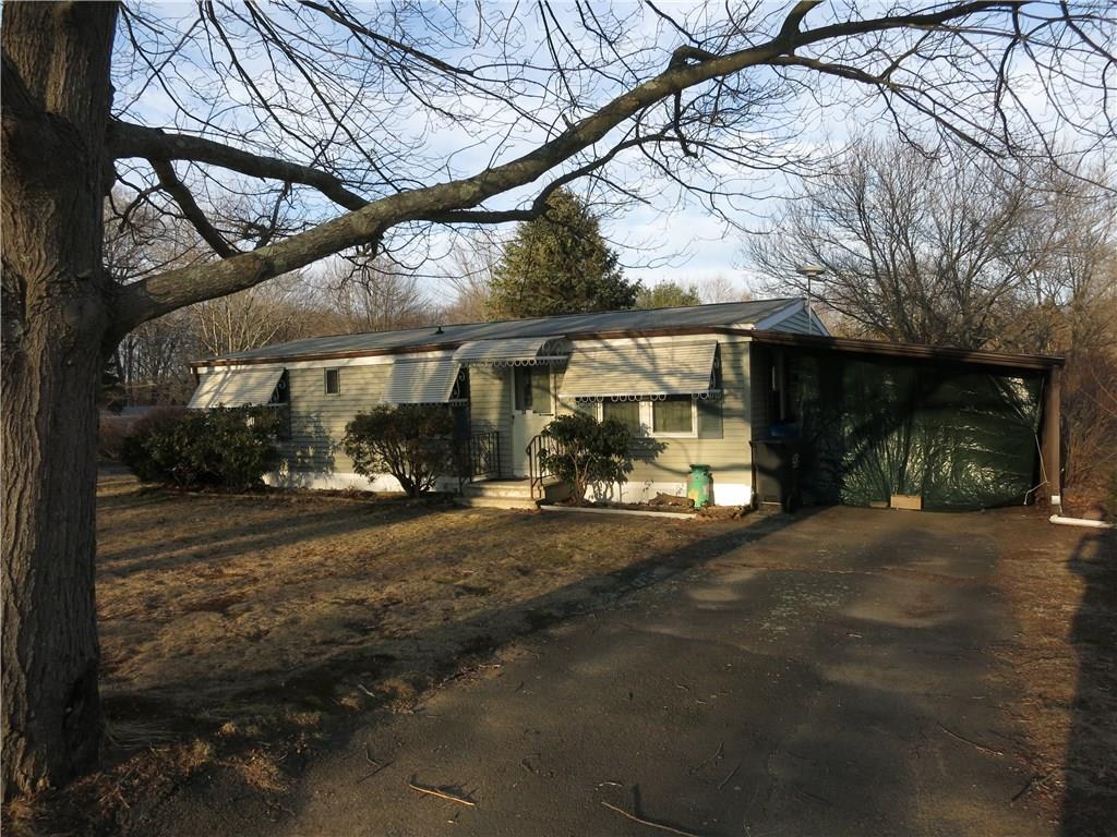 24 Skylark Road Colchester, CT 06415 - Photo 1 of 1 a view of a house with a yard and sitting area