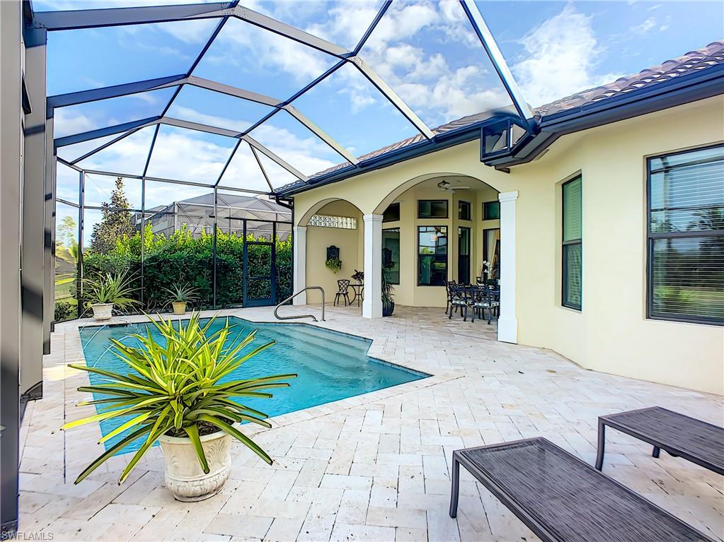 14693 Reserve Lane Naples, FL 34109 - Photo 1 of 34 a house view with a outdoor space
