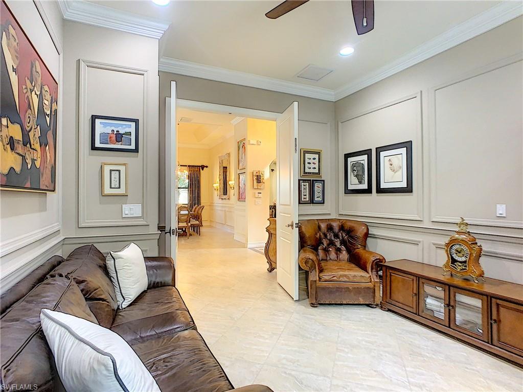 14693 Reserve Lane Naples, FL 34109 - Photo 18 of 34 a living room with furniture and a window
