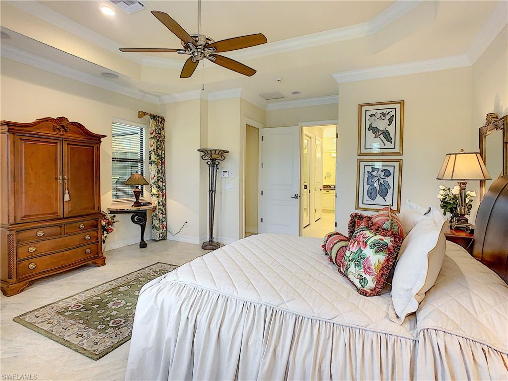 14693 Reserve Lane Naples, FL 34109 - Photo 20 of 34 a bedroom with a bed and furniture