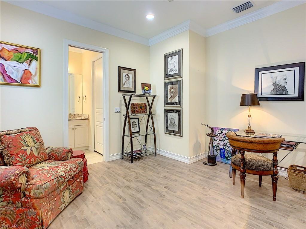 14693 Reserve Lane Naples, FL 34109 - Photo 26 of 34 a living room with furniture a piano and a window