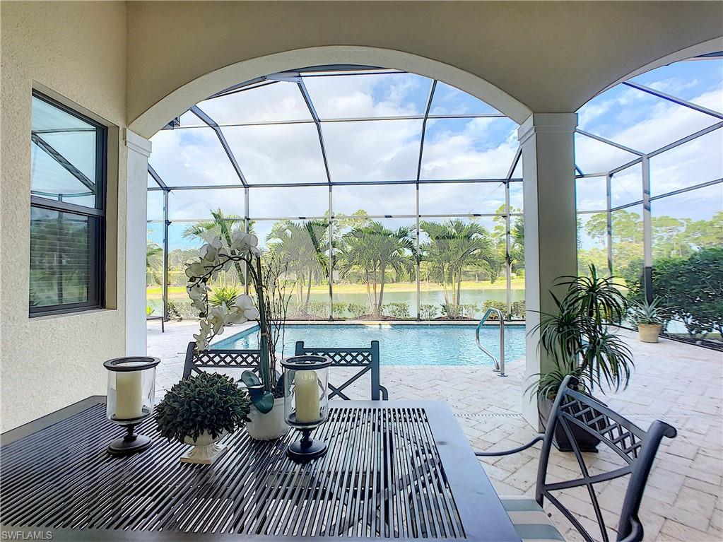 14693 Reserve Lane Naples, FL 34109 - Photo 29 of 34 a living room with furniture and a large window