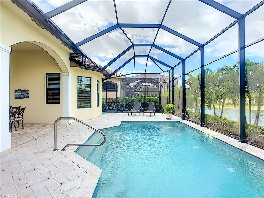 14693 Reserve Lane Naples, FL 34109 - Photo 30 of 34 a living room with a large window