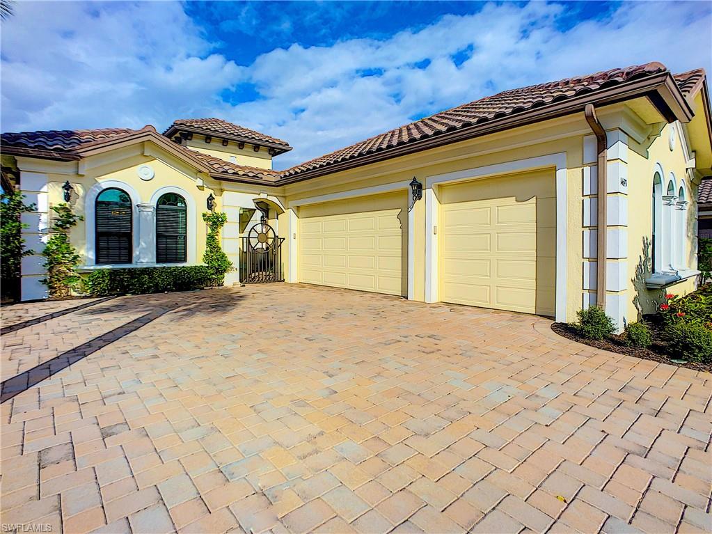 14693 Reserve Lane Naples, FL 34109 - Photo 3 of 34 a view of a house with wooden fence