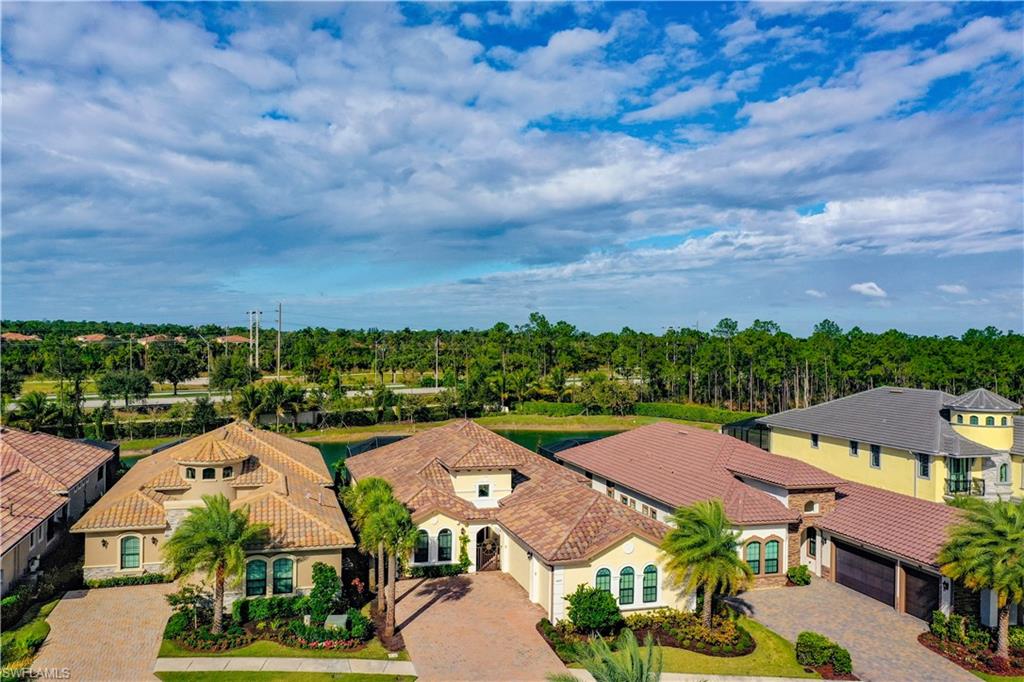 14693 Reserve Lane Naples, FL 34109 - Photo 4 of 34 an aerial view of residential houses with outdoor space and street view