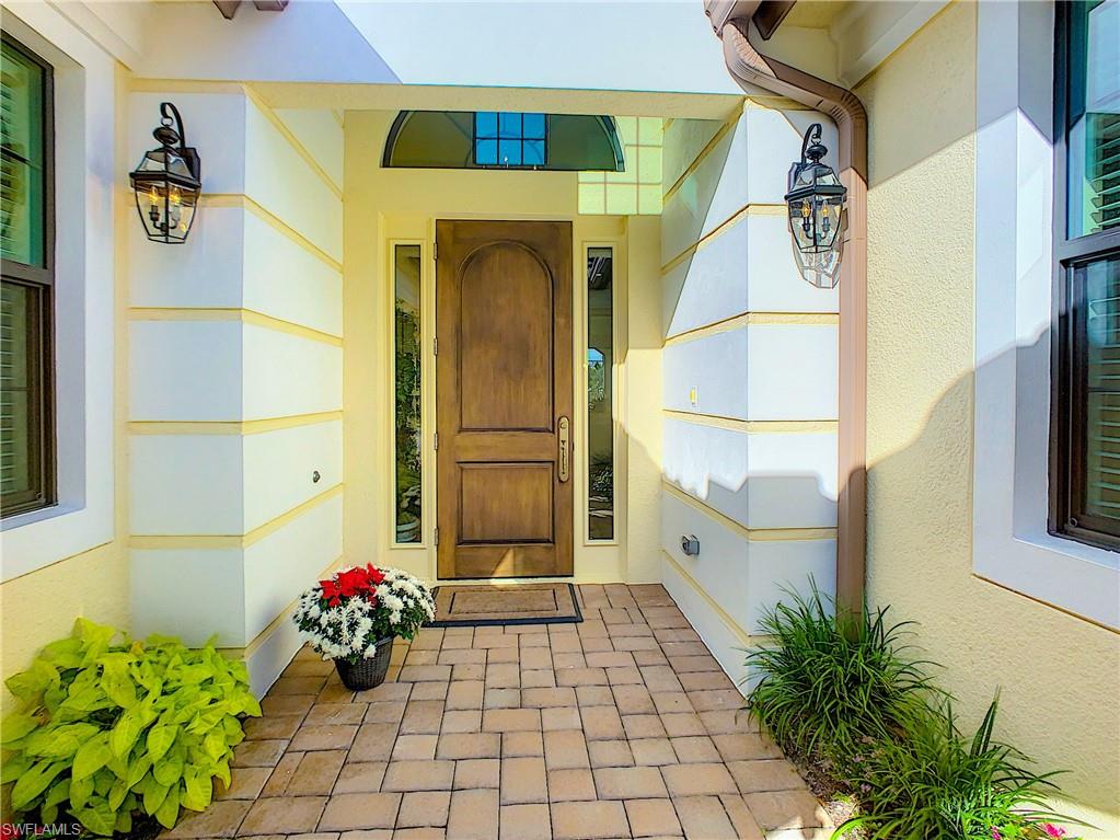 14693 Reserve Lane Naples, FL 34109 - Photo 5 of 34 a view of a entryway door front of house