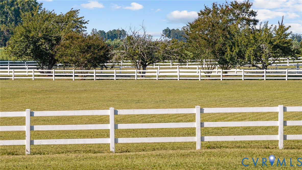 1801 Georgetown Road Heathsville, VA 22473 - Photo 27 of 83 Expansive green pasture framed by white fencing an