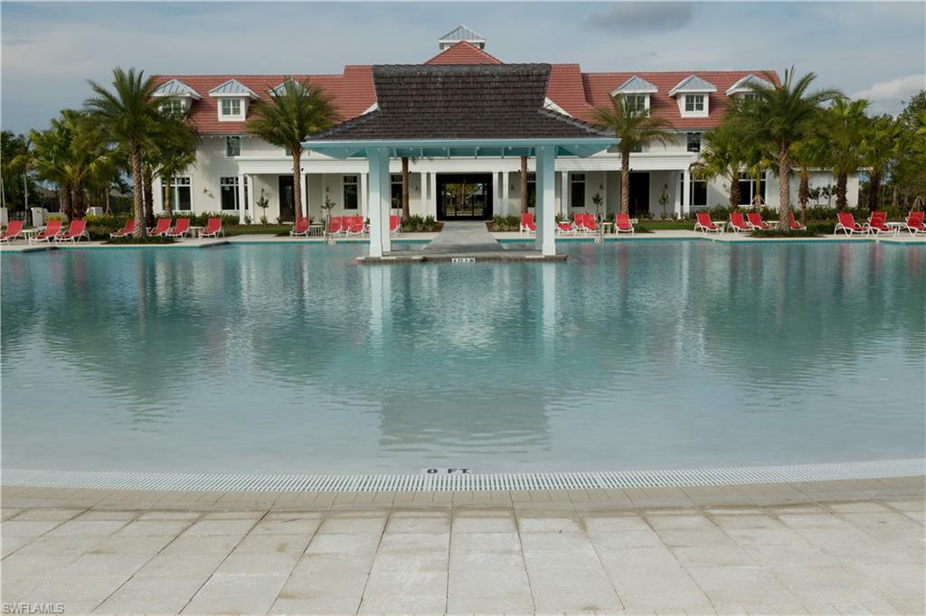 9004 Calypso Court Naples, FL 34113 - Photo 37 of 44 a view of building with river in front of it