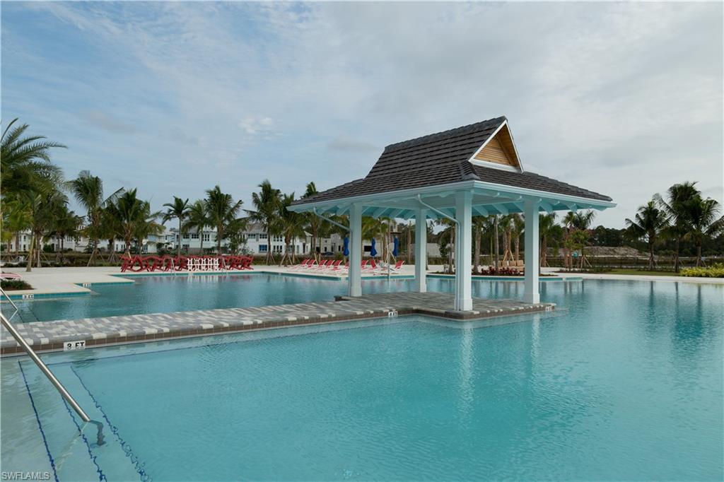 9004 Calypso Court Naples, FL 34113 - Photo 43 of 44 a view of a house with a yard and sitting area