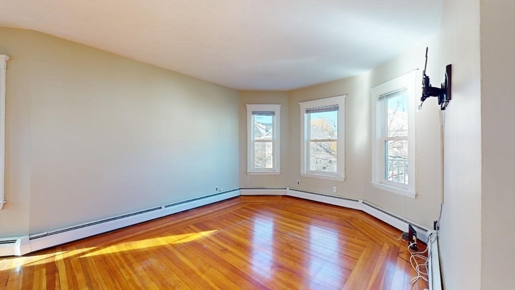 17 Gorham Road, Unit 2 Medford, MA 02155 - Photo 10 of 37 an empty room with windows