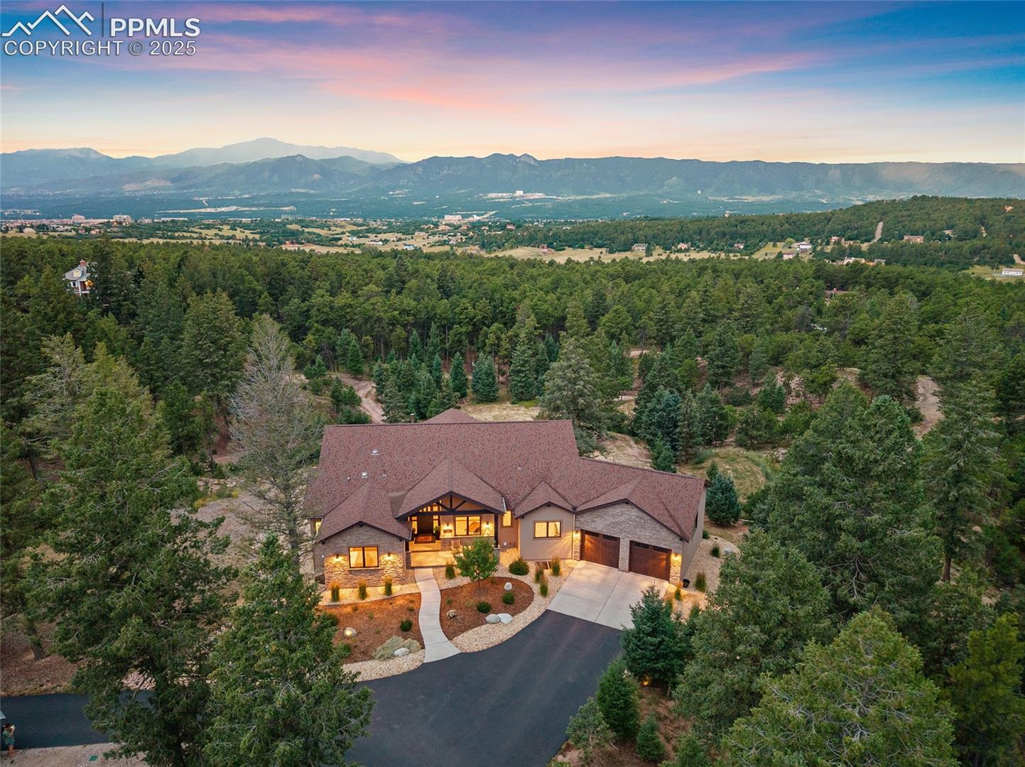 15030 Roller Coaster Road Colorado Springs, CO 80921 - Photo 1 of 49 Front of house with stunning views of Pikes Peak and the Air Force Academy