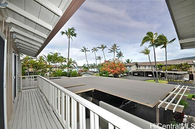 404 Koko Isle Circle, Unit 1802 Honolulu, HI 96825 - Photo 12 of 18 a view of a balcony with chairs and potted plants
