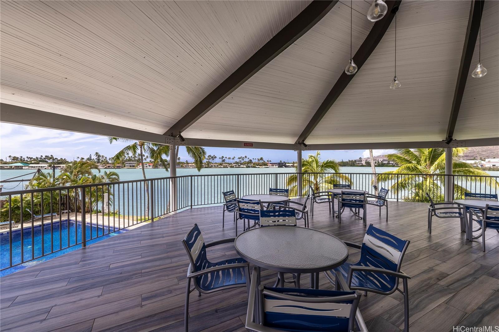 404 Koko Isle Circle, Unit 1802 Honolulu, HI 96825 - Photo 16 of 18 an outdoor space with furniture and wooden floor