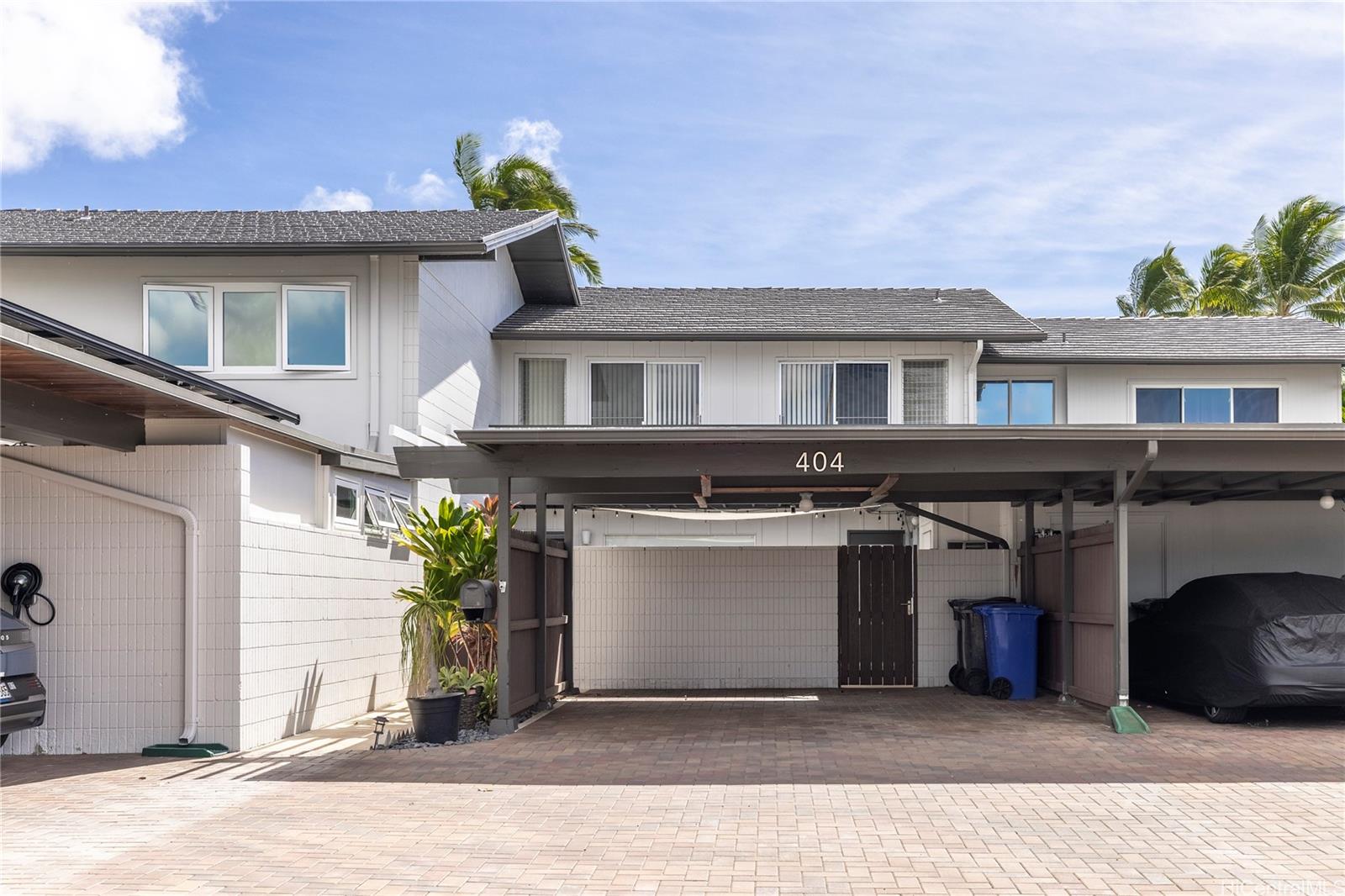 404 Koko Isle Circle, Unit 1802 Honolulu, HI 96825 - Photo 3 of 18 a front view of a house with a garage