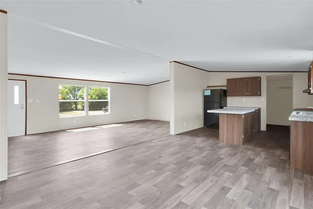 a view of a kitchen with a sink and a window