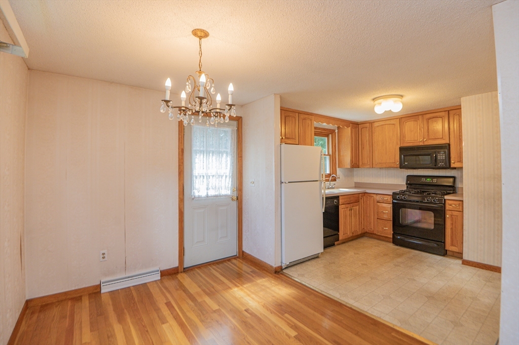 16 Freddy Road Billerica, MA 01821 - Photo 11 of 27 a kitchen with refrigerator and window