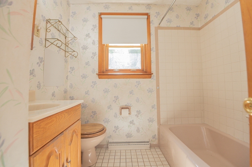 16 Freddy Road Billerica, MA 01821 - Photo 13 of 27 a bathroom with a granite countertop bathtub sink toilet and shower
