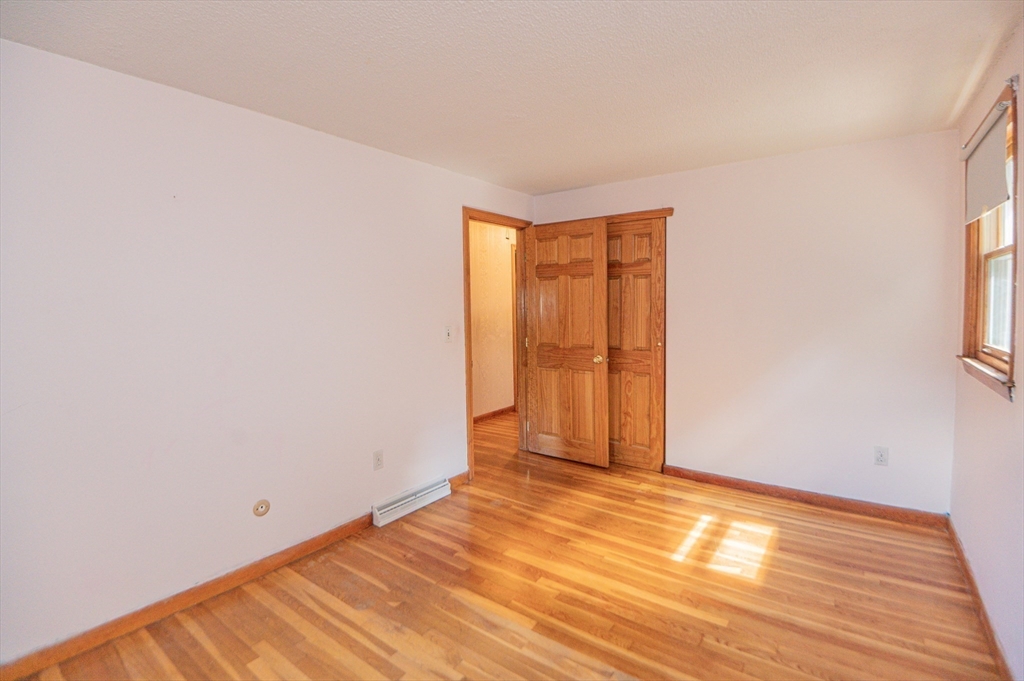 16 Freddy Road Billerica, MA 01821 - Photo 14 of 27 a view of an empty room with wooden floor