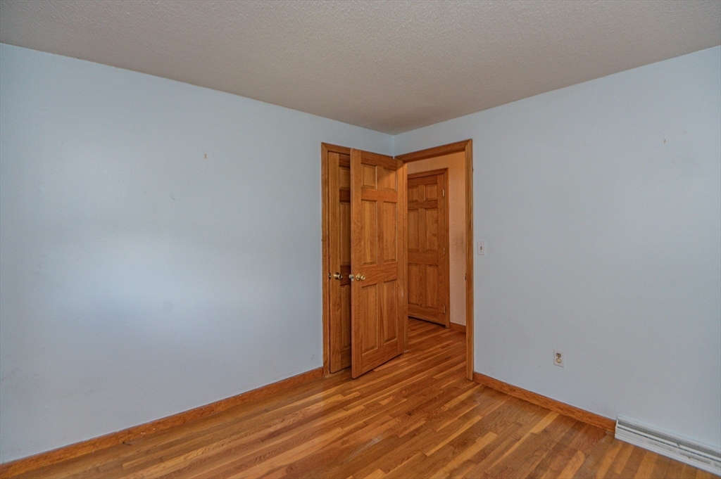 16 Freddy Road Billerica, MA 01821 - Photo 15 of 27 a view of an empty room with wooden floor