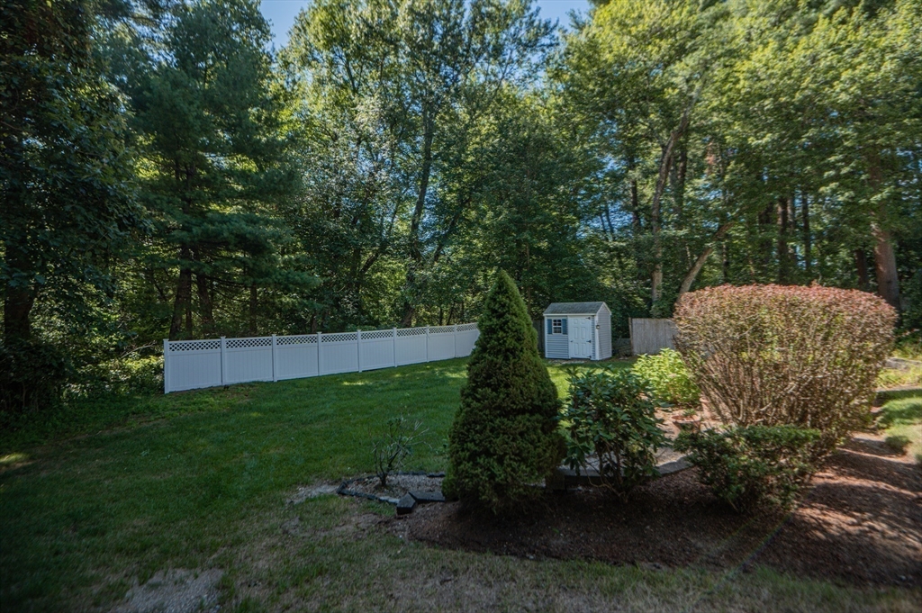 16 Freddy Road Billerica, MA 01821 - Photo 25 of 27 a backyard of a house with lots of green space