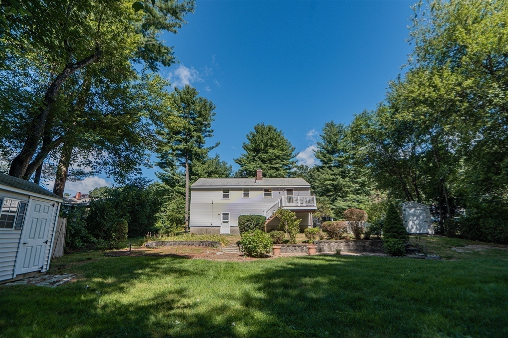 16 Freddy Road Billerica, MA 01821 - Photo 26 of 27 a view of a house with a big yard and large trees