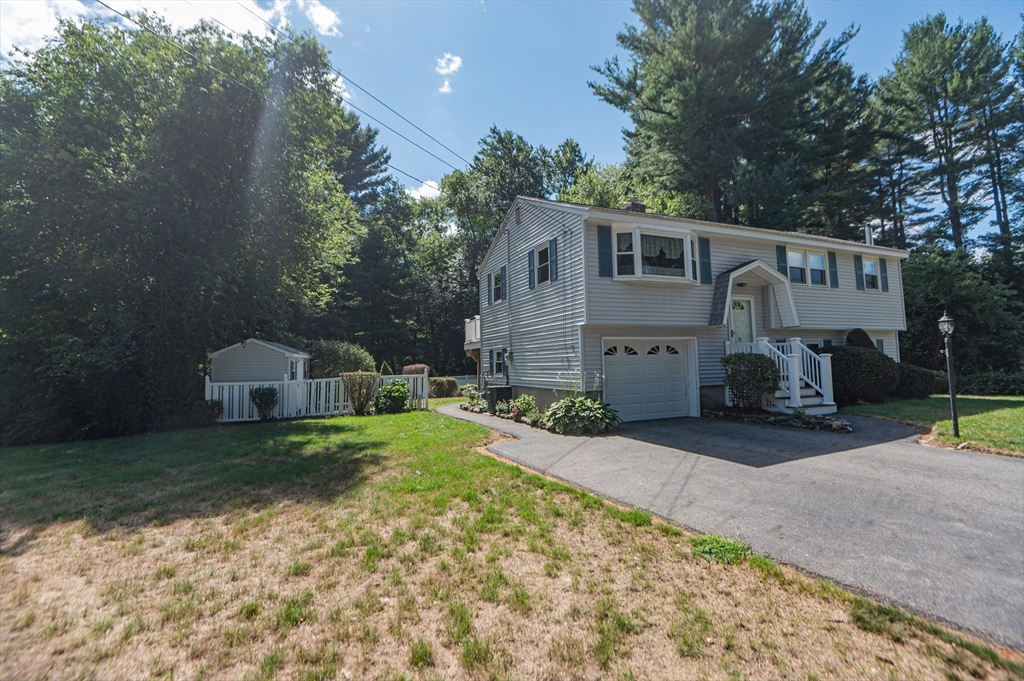 16 Freddy Road Billerica, MA 01821 - Photo 3 of 27 a front view of a house with garden