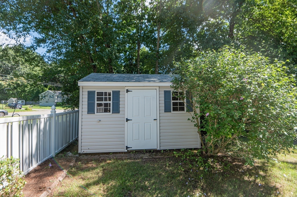 16 Freddy Road Billerica, MA 01821 - Photo 5 of 27 a view of a house with a yard