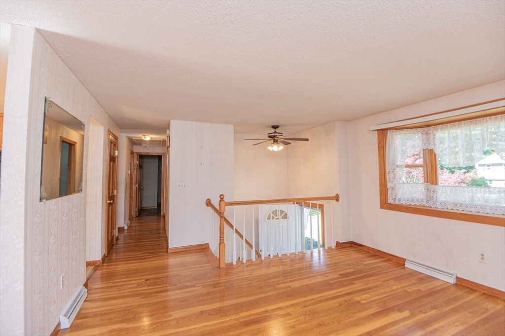 16 Freddy Road Billerica, MA 01821 - Photo 8 of 27 a view of a livingroom with wooden floor and furniture