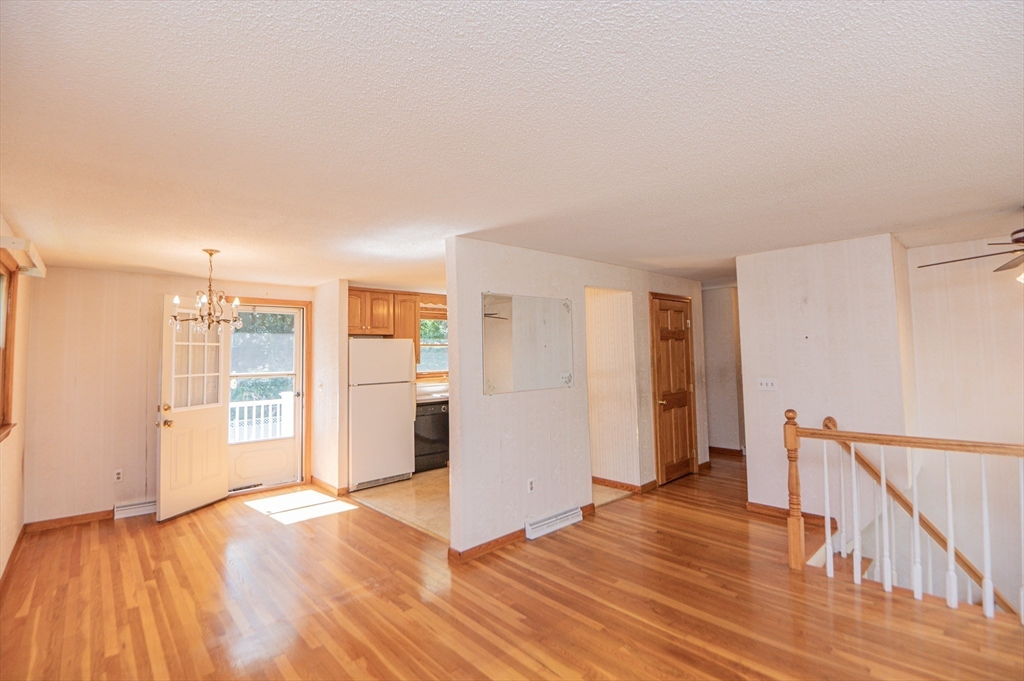 16 Freddy Road Billerica, MA 01821 - Photo 9 of 27 a view of an empty room with window and wooden floor
