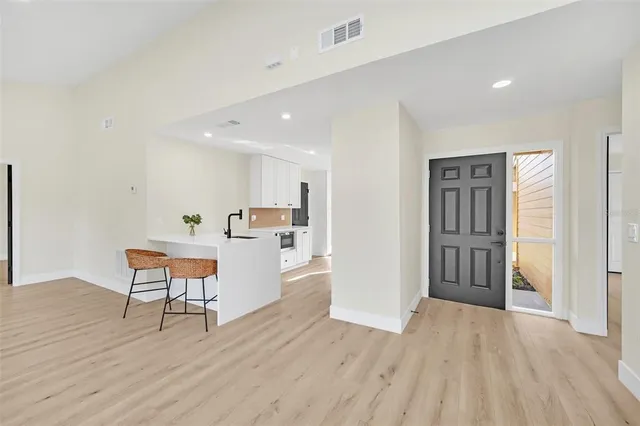 a view of kitchen with furniture and wooden floor