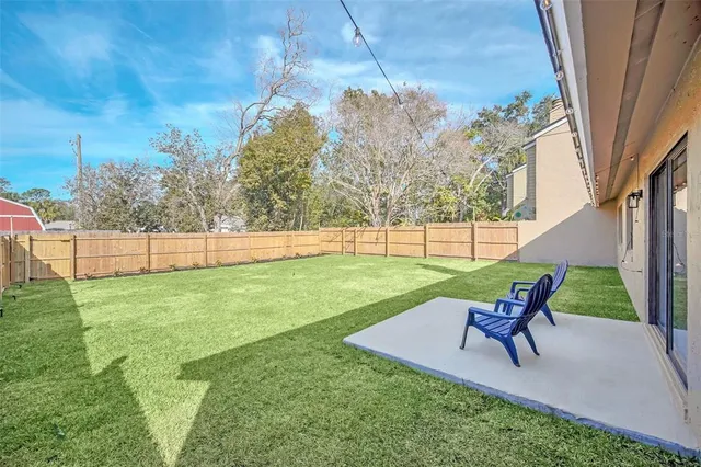 a view of yard with outdoor seating