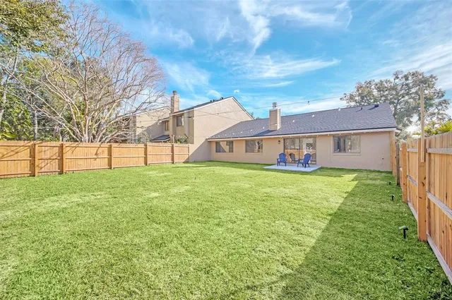 a view of a house with a big yard