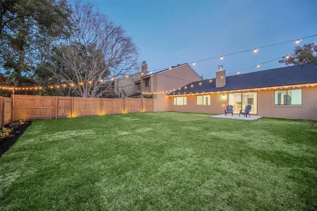 a view of a house with a back yard