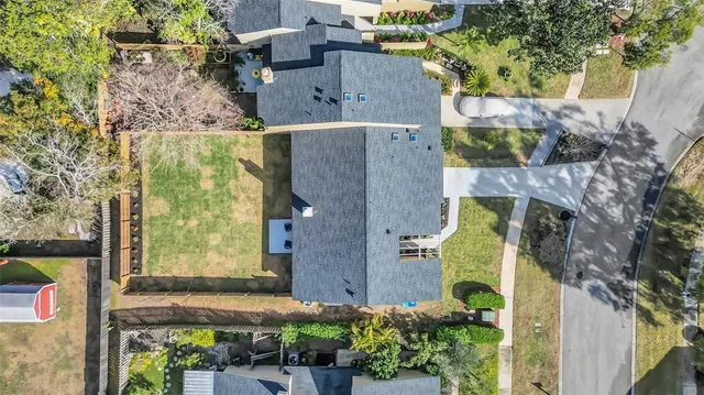 an aerial view of a house with a garden