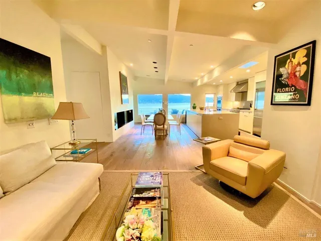 a outdoor living space with furniture and a flat screen tv