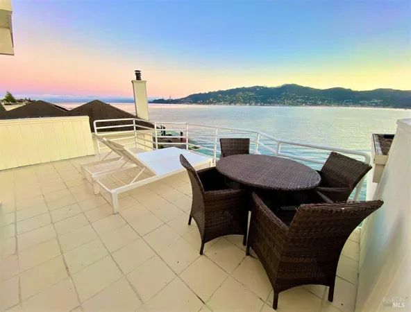 a view of a terrace with furniture and stove