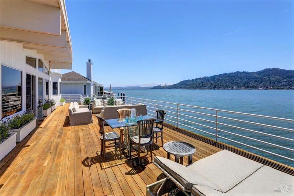 55 West Shore Road Belvedere, CA 94920 - Photo 3 of 16 a view of a balcony with two chairs and a table