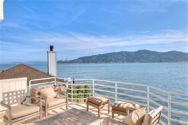 a view of a chairs and table on the terrace
