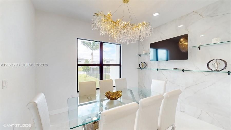 8350 Royal County Down Road Boca Raton, FL 33434 - Photo 5 of 52 a living room with furniture a flat screen tv and a chandelier