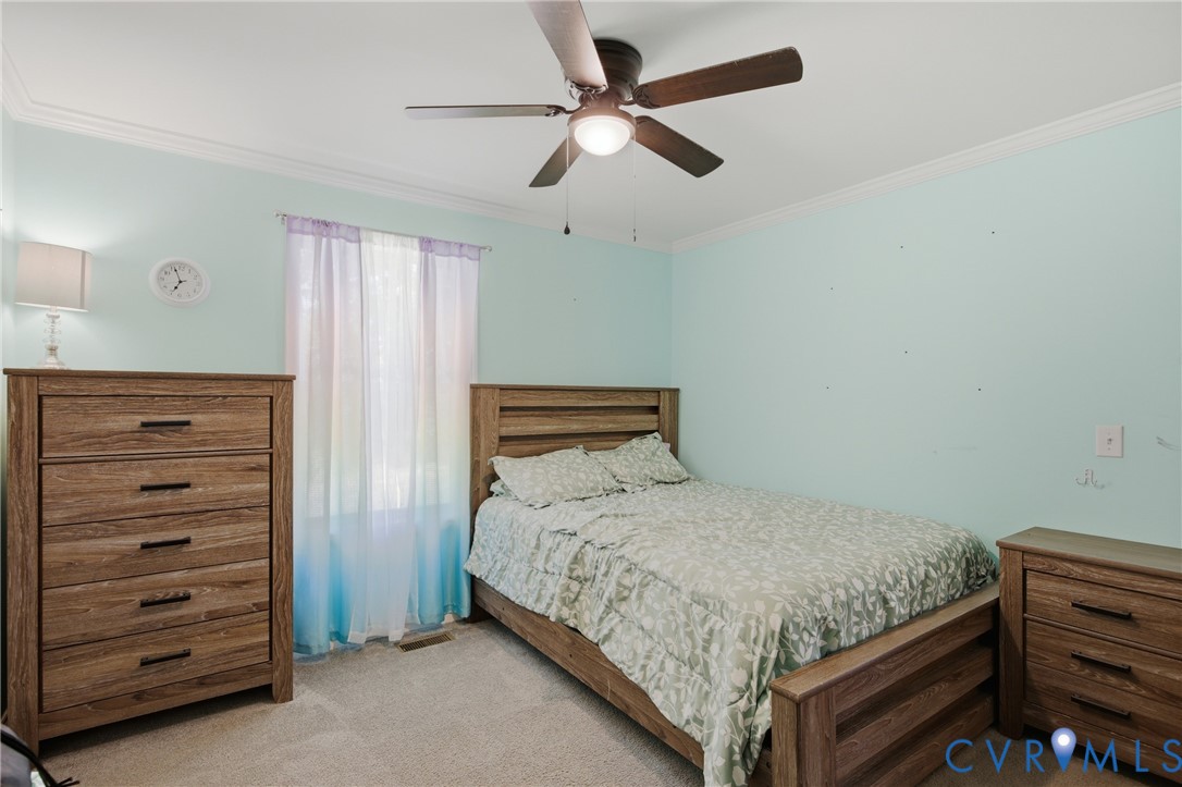 93 Faraway Road Saluda, VA 23149 - Photo 23 of 58 a bedroom with a bed and a dresser