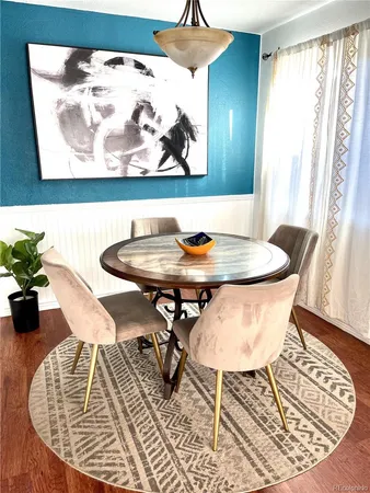 a dining room with furniture and window