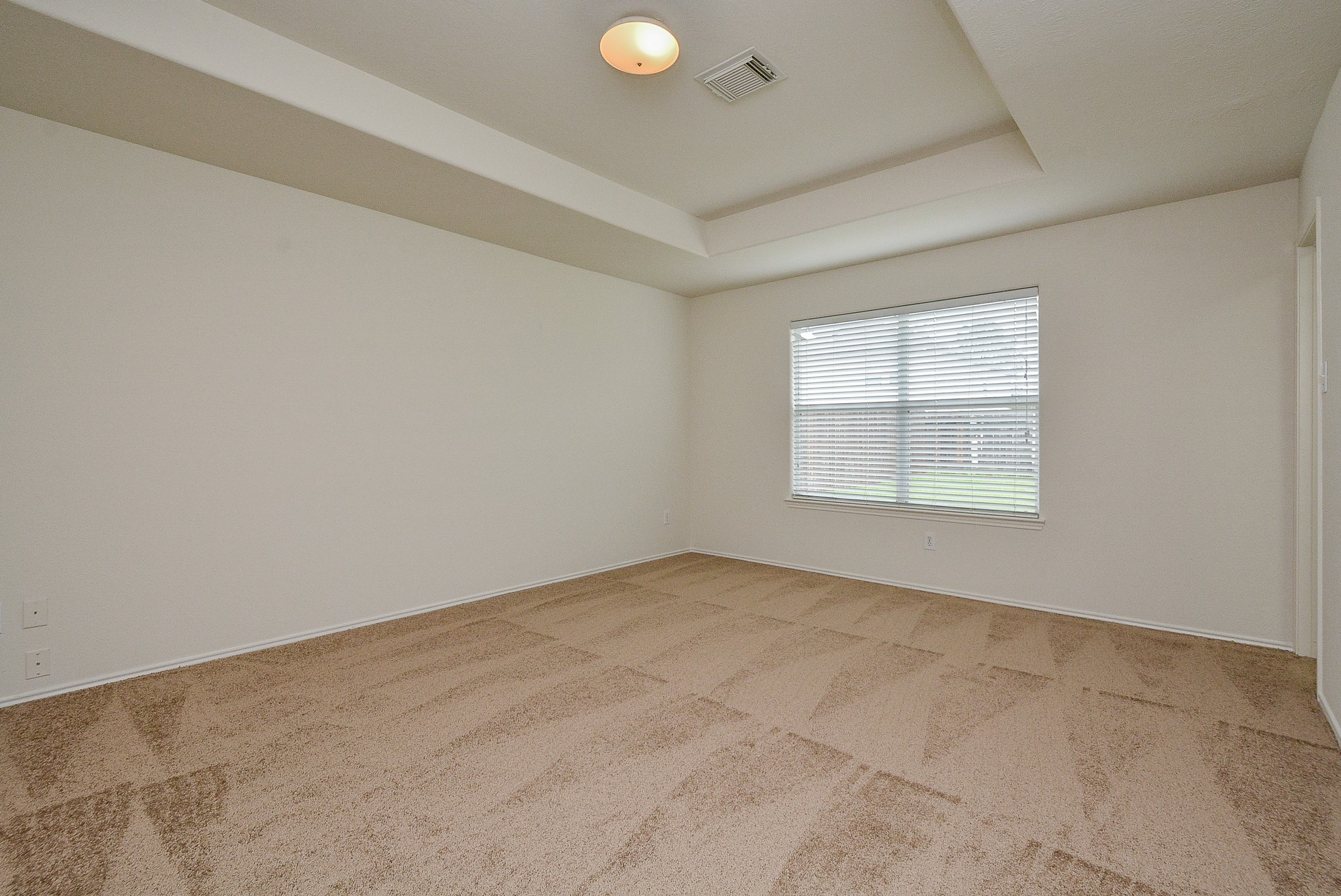 18326 Thicket Grove Road Houston, TX 77084 - Photo 20 of 50 an empty room with windows
