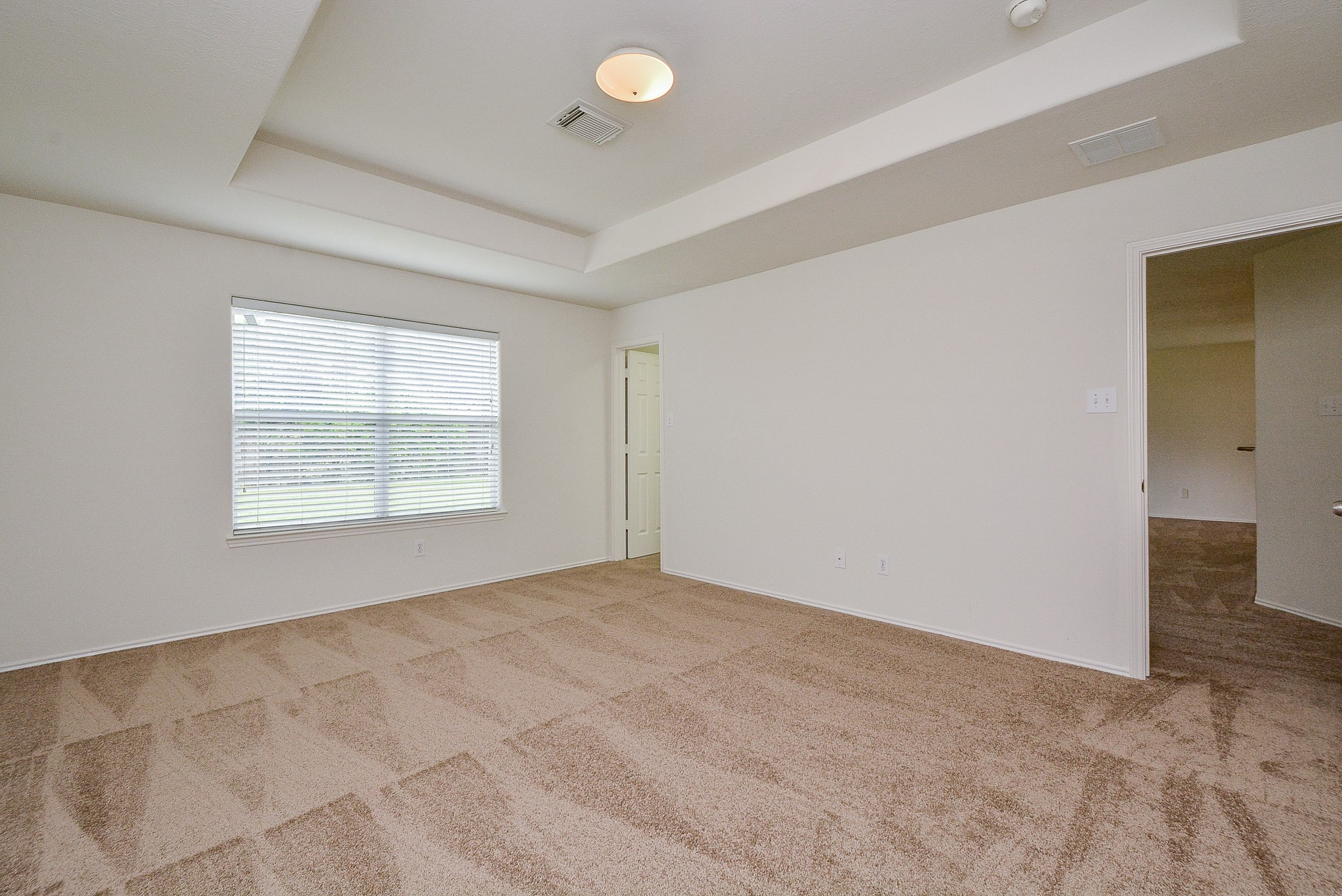 18326 Thicket Grove Road Houston, TX 77084 - Photo 22 of 50 an empty room with windows and closet