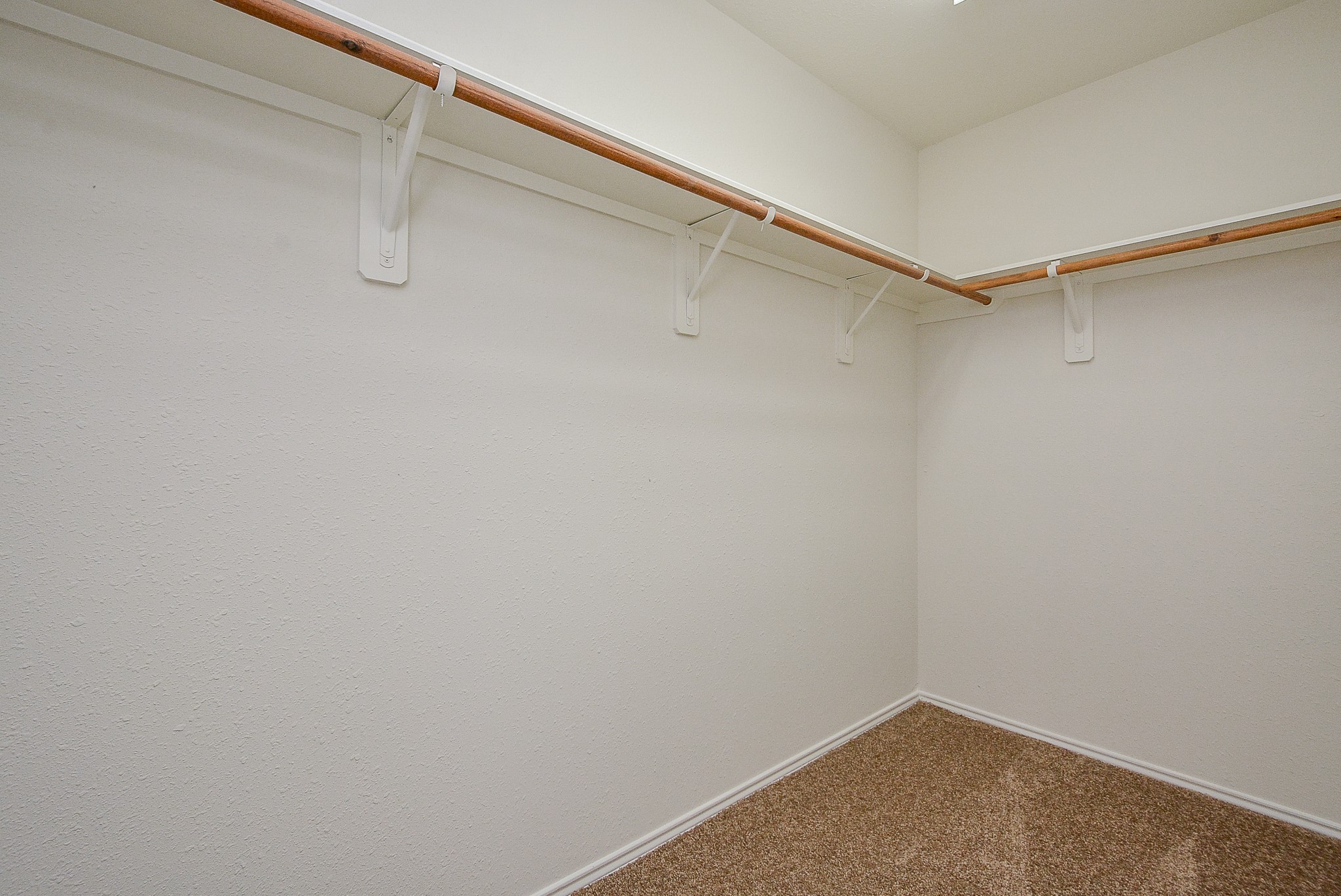 18326 Thicket Grove Road Houston, TX 77084 - Photo 24 of 50 a view of a room with racks on the wall