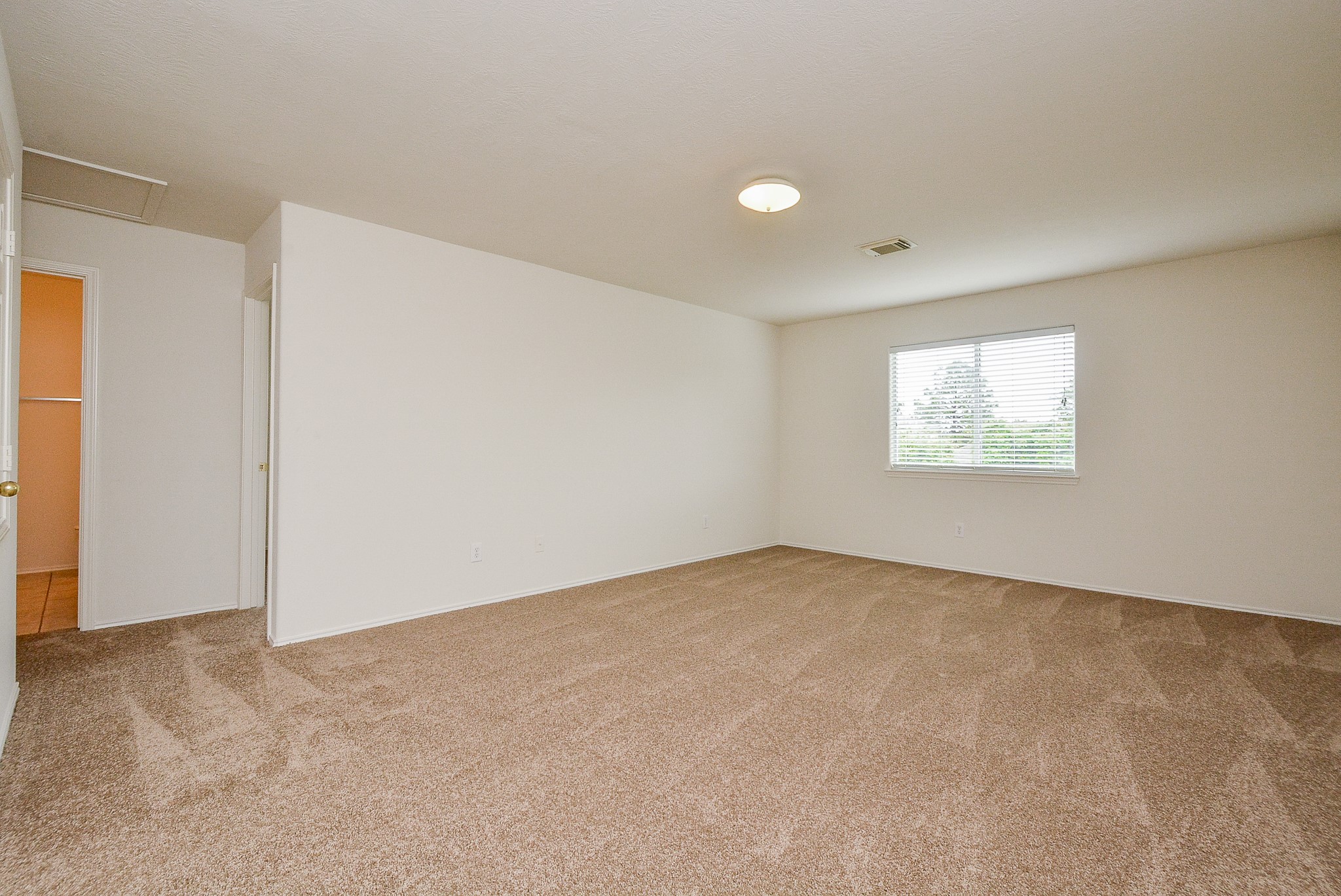18326 Thicket Grove Road Houston, TX 77084 - Photo 28 of 50 an empty room with a window