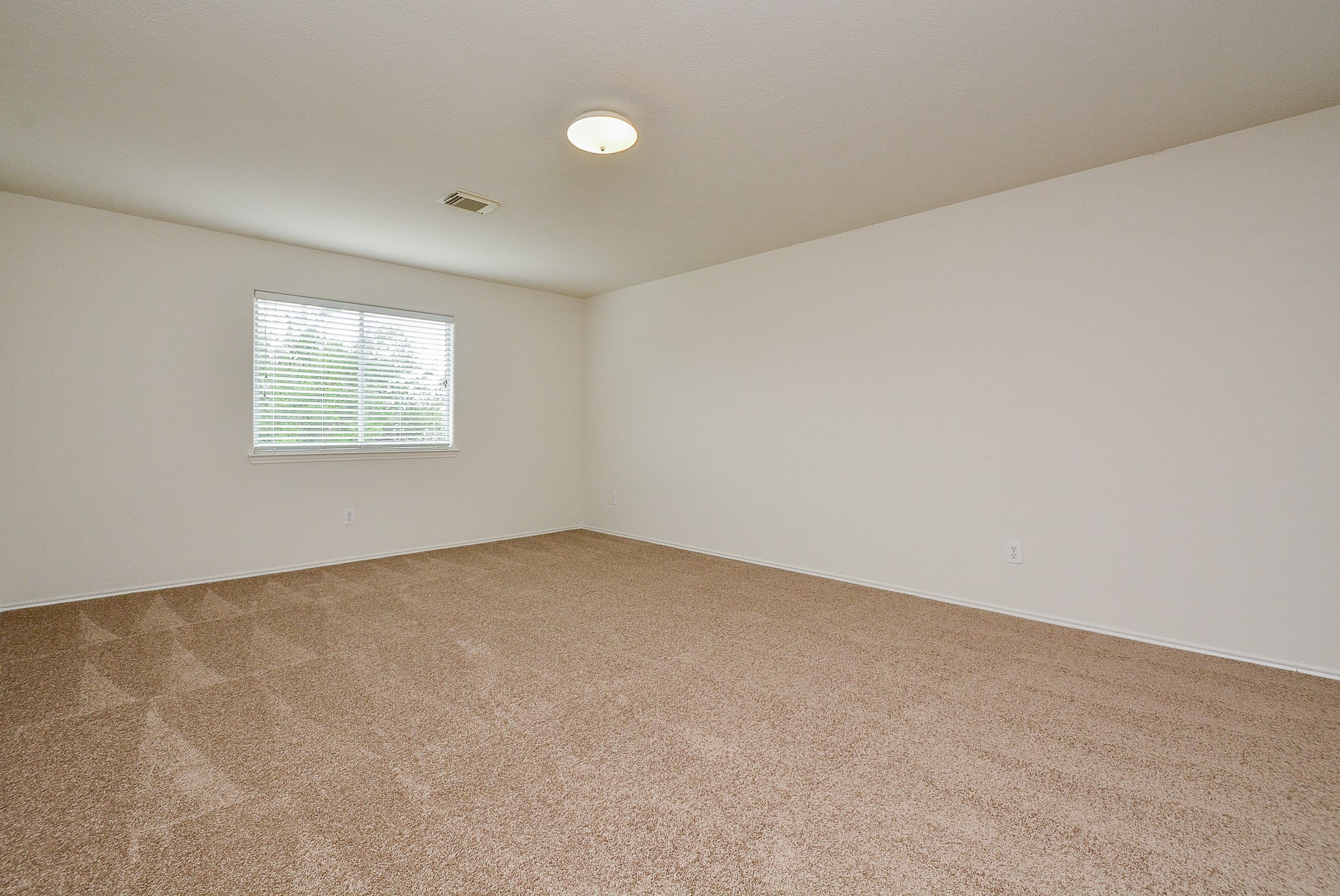 18326 Thicket Grove Road Houston, TX 77084 - Photo 29 of 50 an empty room with windows