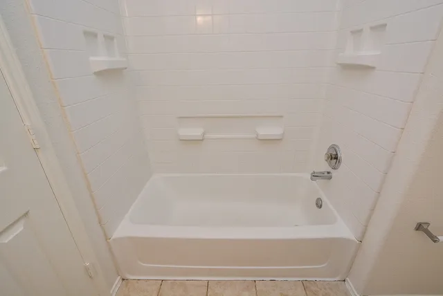 a close up of a bathtub in a bathroom